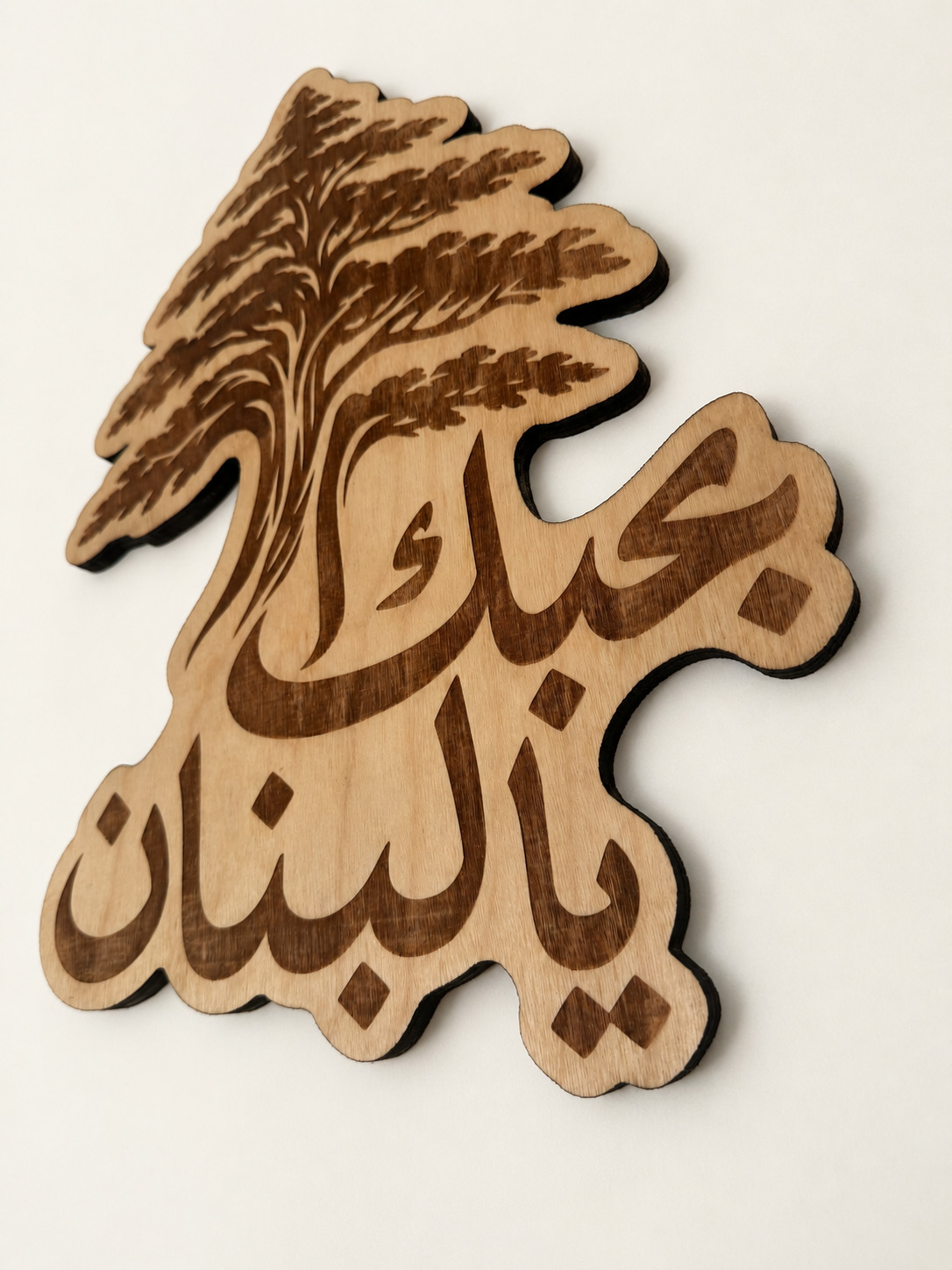 Detail photograph of Lebanon · Cedar & Calligraphy, with background and lighting retouched.