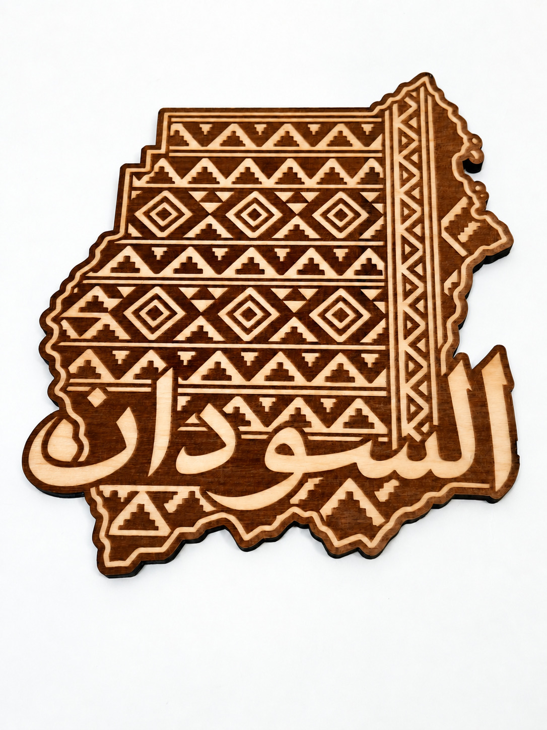 Photograph of Sudan · Pattern & Calligraphy with the faded engraving band locally tone-corrected; original photo is provided separately.